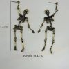 Gold Skeleton Earrings - Image 4